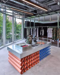 Off White: store with an orange pipe display table