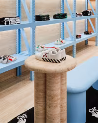 Off White: sneakers on pale blue shelving